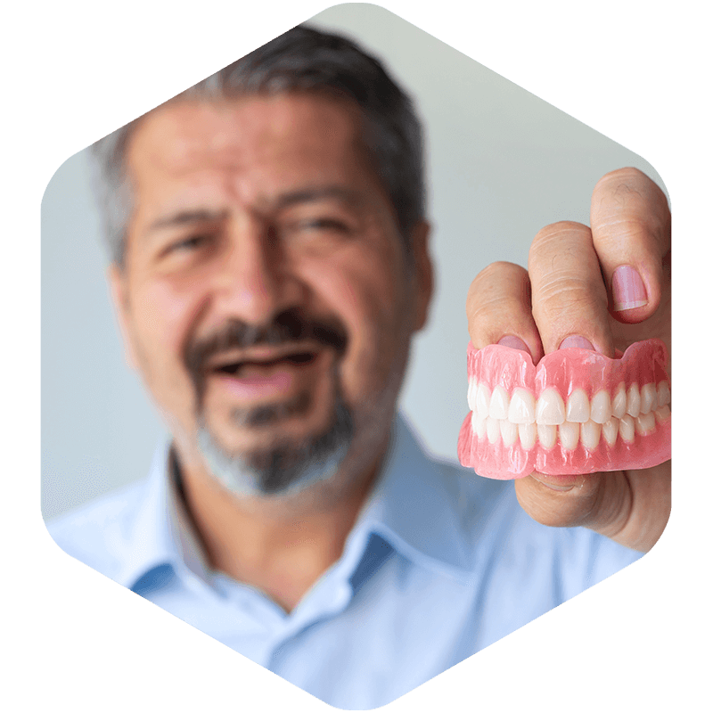 Male showing his dentures.