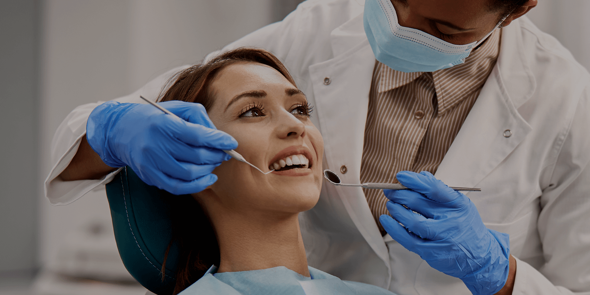 A patient being examined by the dentist.