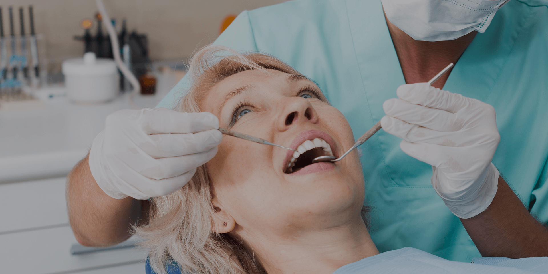 A dentist working with a patient.